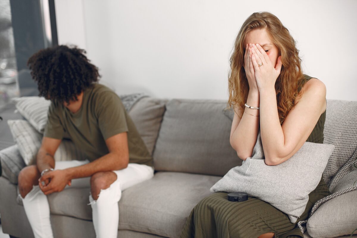 Couple sitting apart after an argument